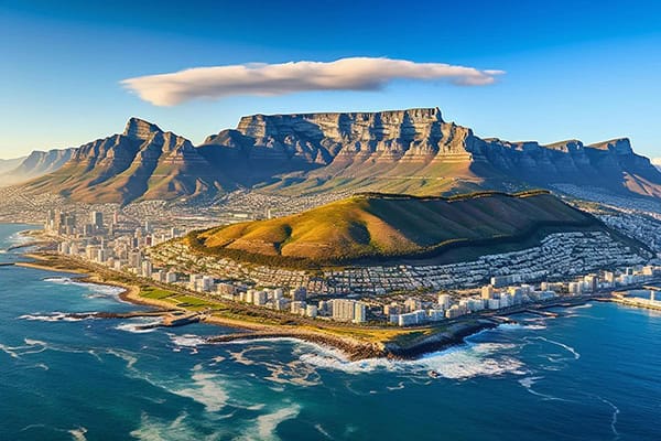 city-with-mountain-background-city-background Overhead view of Cape Town's top places to visit, featuring table mountain and the stunning atlantic coastline.