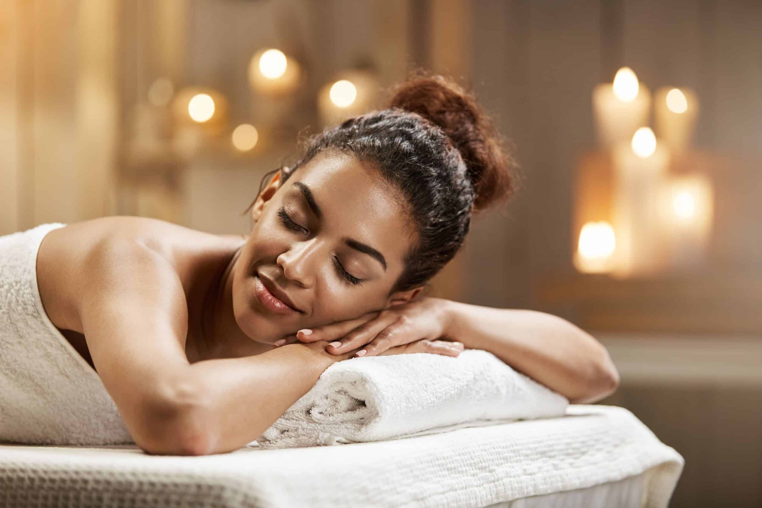 beautiful african woman resting relaxing spa (1) Relaxed woman getting a massage as part of Cape Town winter hotel specials