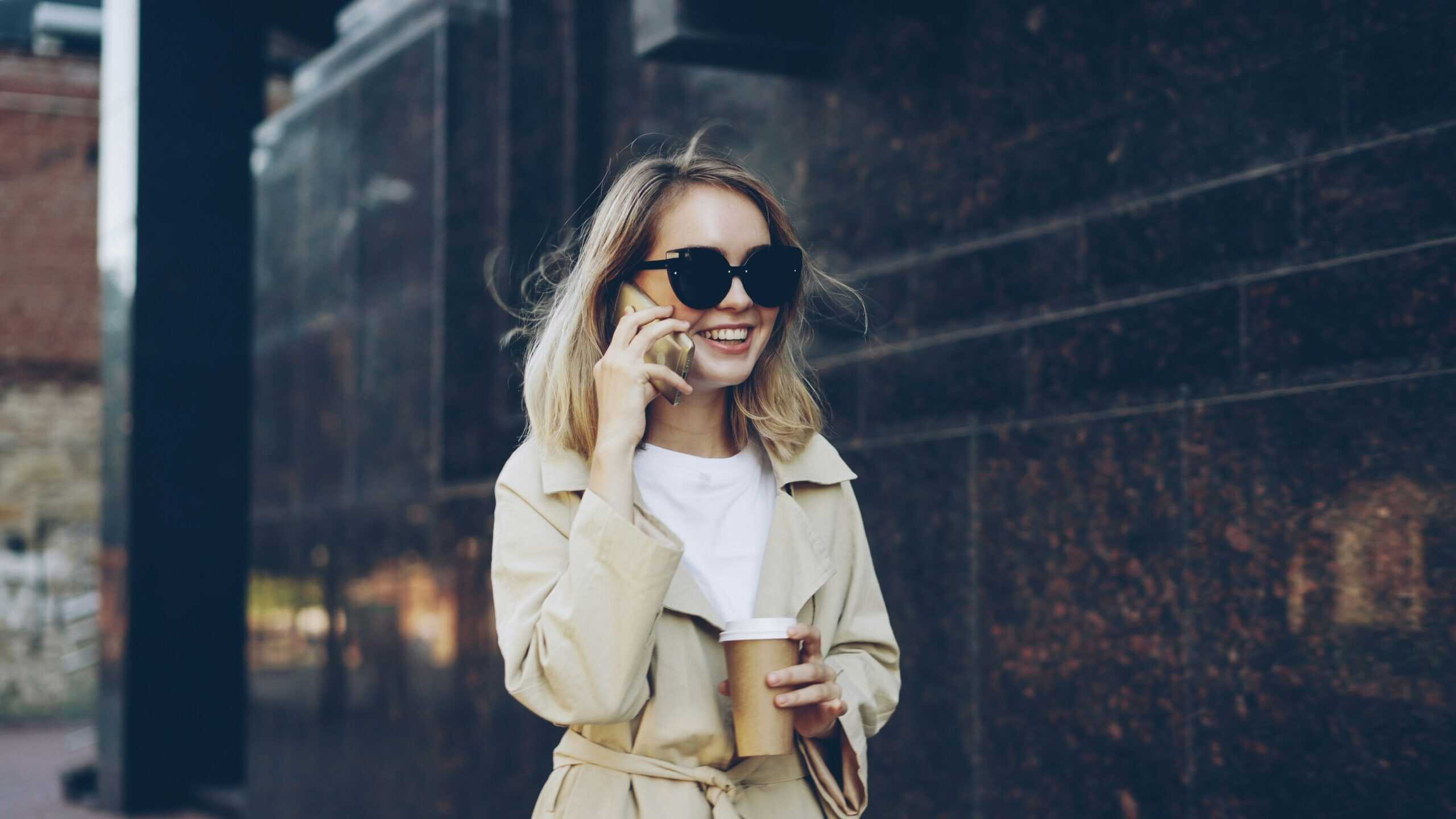 vitaly-gariev-MIp6PLWng_0-unsplash-min Business professional walking with a coffee while on a phone call slug:guide-month-to-month-rentals-cape-town.