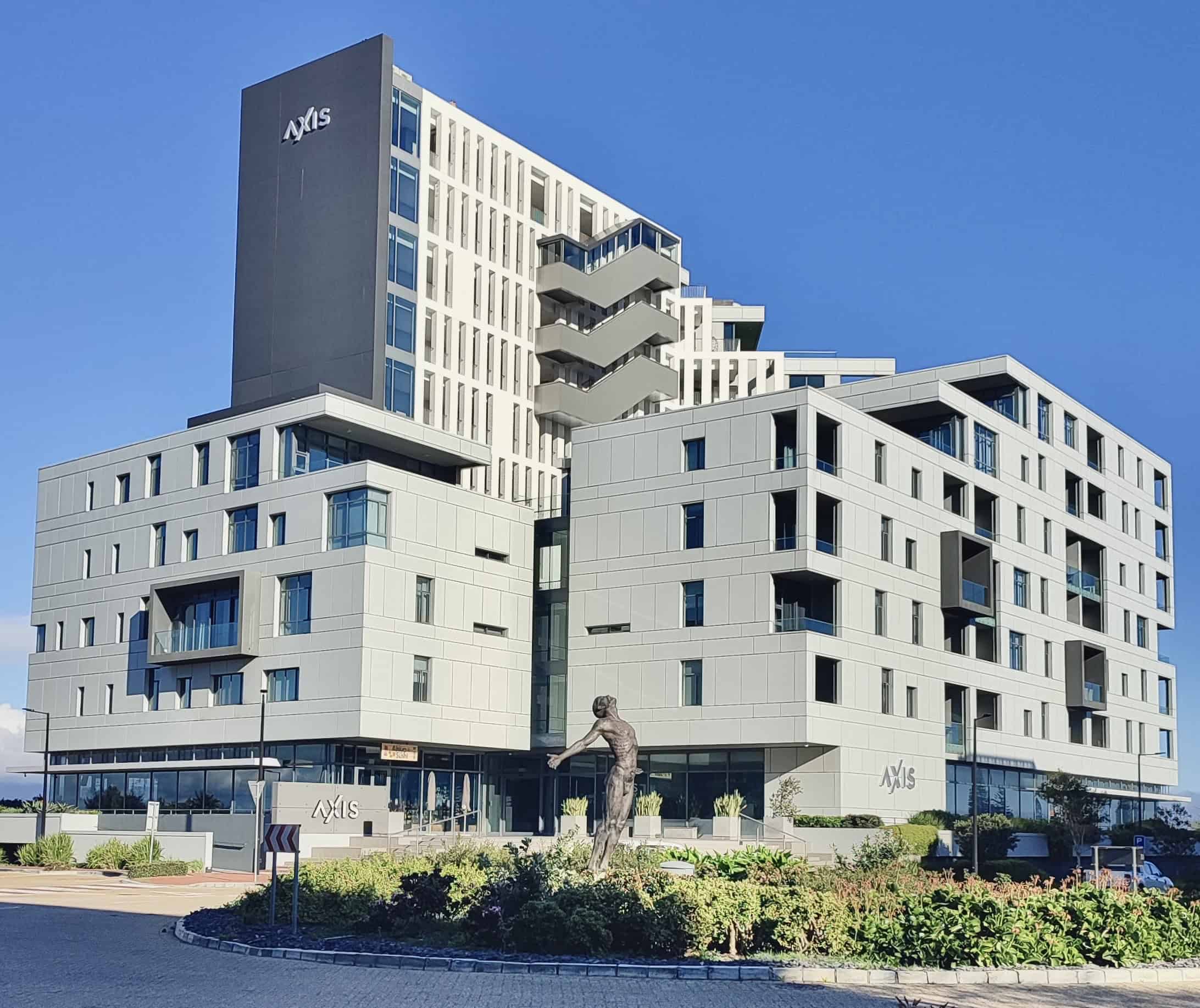 Axis Luxury Apartments A wide shot of the Axis Luxury Apartments under a clear sky showcasing remote work accommodation in Cape Town